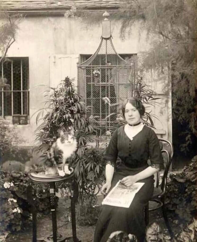 Woman with her cat, her bird and her marijuana plant. Paris, 1910