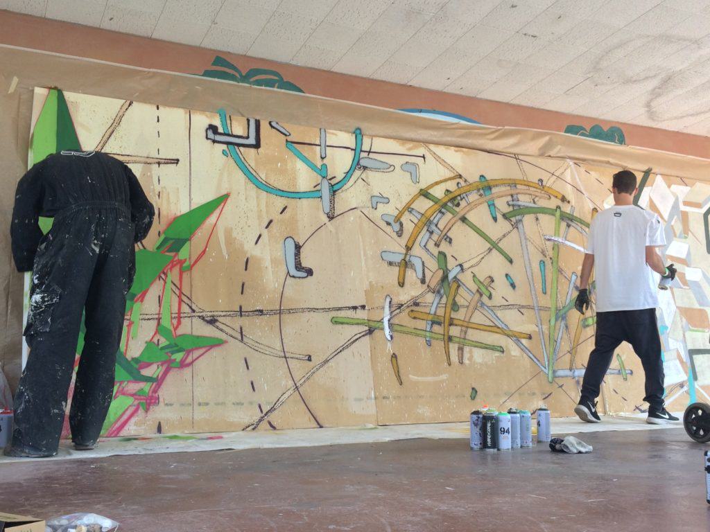Graffiti artists spraying on the stage