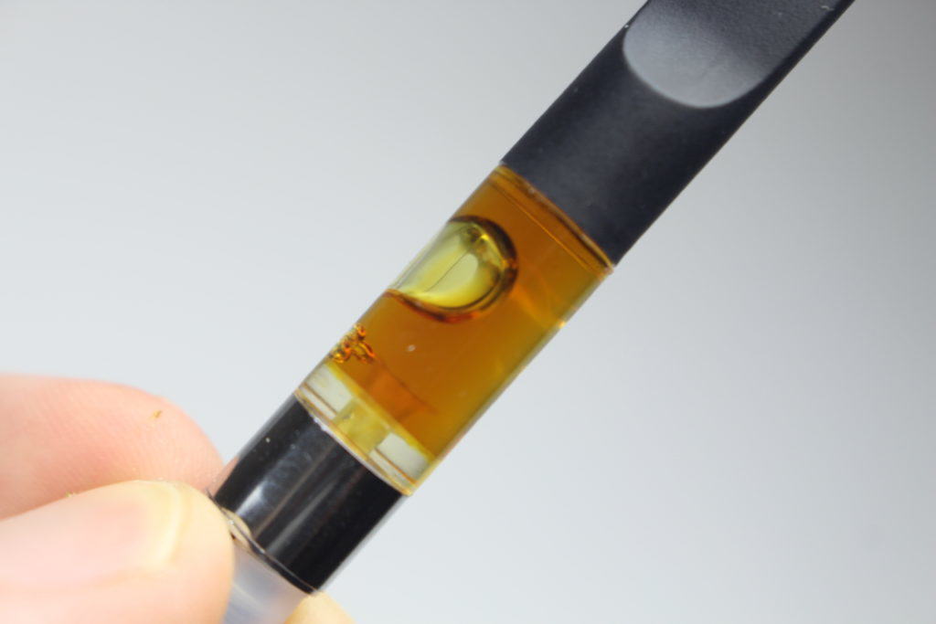 Vape pen cartridge filled with distillate