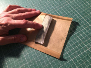 Folded parchment to direct the rosin flow