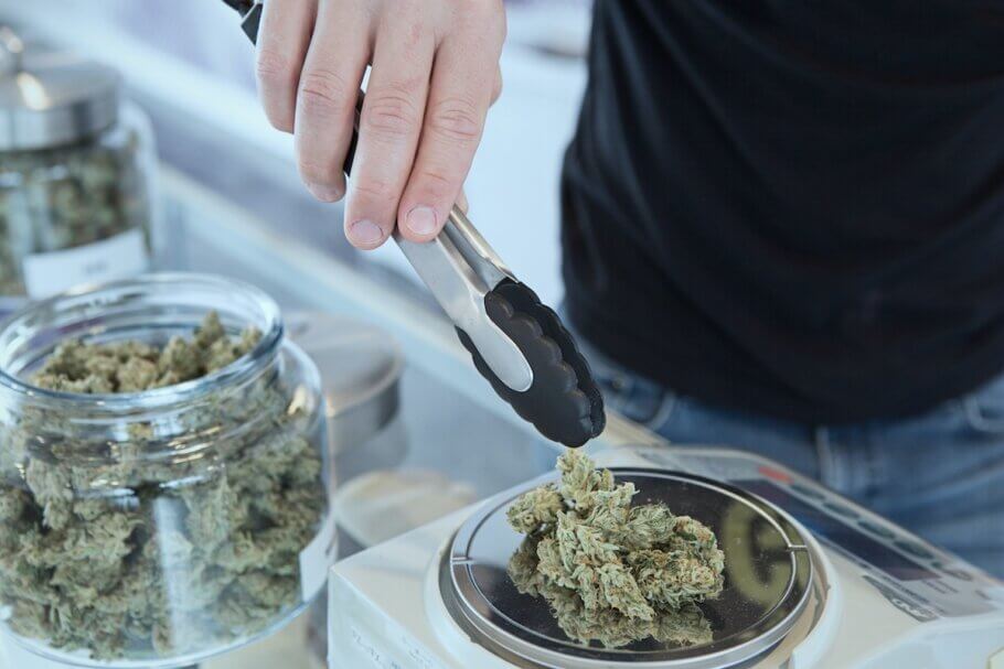A 'budtender' weighing some cookies to go